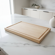 Wooden cutting board on a light gray background